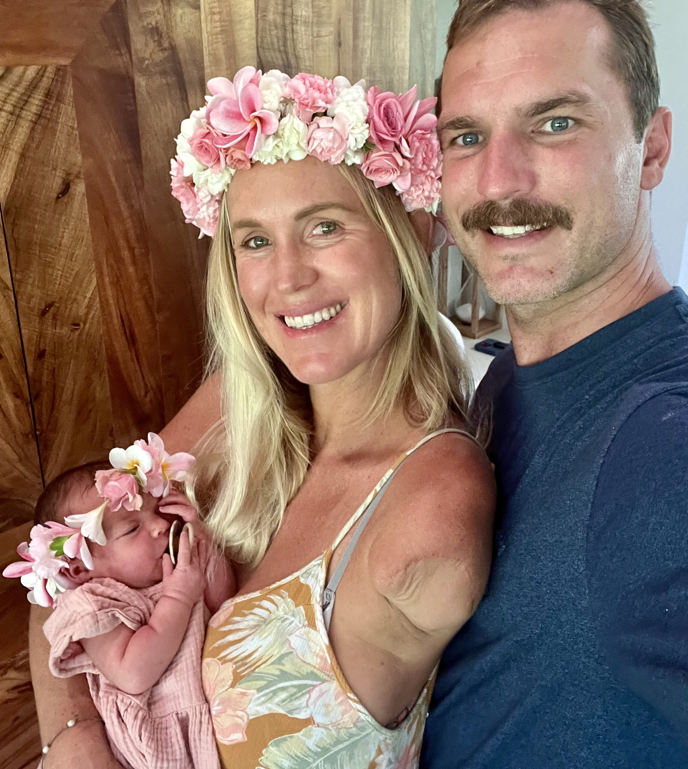 Bethany and Adam hold their new daughter